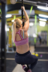 Image showing woman doing rope climbing