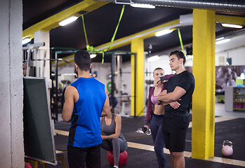 Image showing athletes getting instructions from trainer