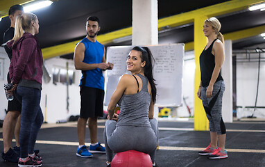 Image showing athletes getting instructions from trainer