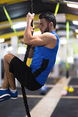 Image showing man doing rope climbing