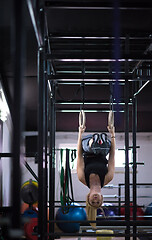 Image showing woman working out on gymnastic rings