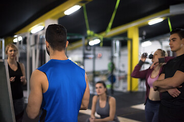 Image showing athletes getting instructions from trainer