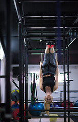 Image showing woman working out on gymnastic rings