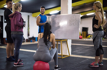 Image showing athletes getting instructions from trainer