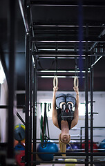 Image showing woman working out on gymnastic rings