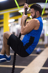 Image showing man doing rope climbing