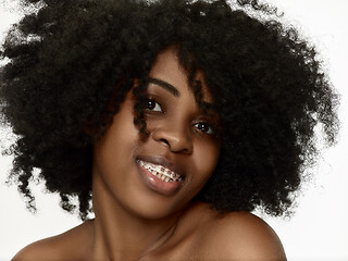 Image showing Portrait of a young black woman smiling with braces