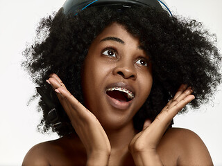 Image showing Portrait of a young black woman smiling with braces