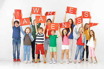 Image showing Awareness. Group of children with a red banners isolated in white