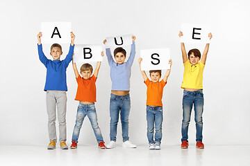 Image showing Abuse. Group of children with a banners isolated in white