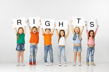 Image showing Rights. Group of children with a banners isolated in white