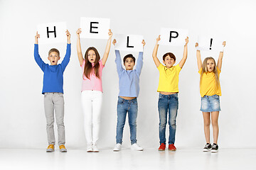 Image showing Help. Group of children with a banners isolated in white