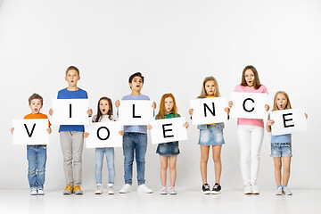 Image showing Violence. Group of children with a banners isolated in white