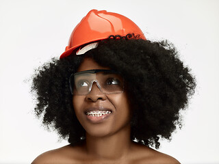 Image showing Portrait of confident female worker in orange helmet