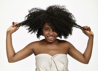 Image showing Portrait of a young black woman smiling with braces