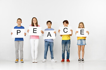 Image showing Peace. Group of children with a banners isolated in white