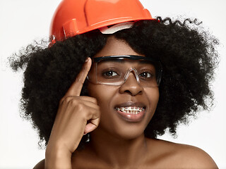 Image showing Portrait of confident female worker in orange helmet