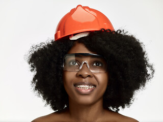 Image showing Portrait of confident female worker in orange helmet