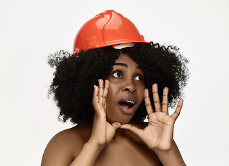 Image showing Portrait of confident female worker in orange helmet