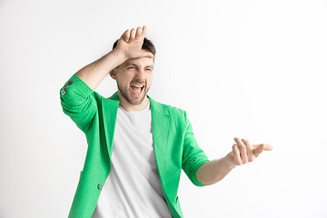 Image showing Losers go home. Portrait of happy guy showing loser sign over forehead