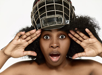 Image showing Female hockey player close up helmet and mask