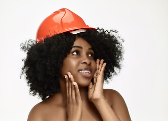 Image showing Portrait of confident female worker in orange helmet