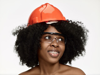 Image showing Portrait of confident female worker in orange helmet