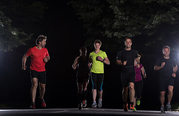 Image showing runners team on the night training