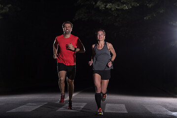 Image showing runners team on the night training