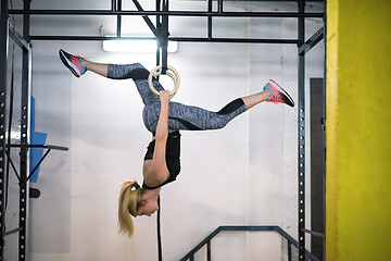 Image showing woman working out on gymnastic rings