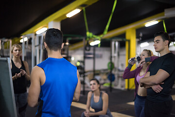 Image showing athletes getting instructions from trainer