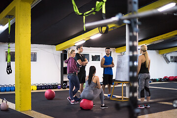 Image showing athletes getting instructions from trainer