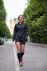 Image showing sporty female runner training for marathon