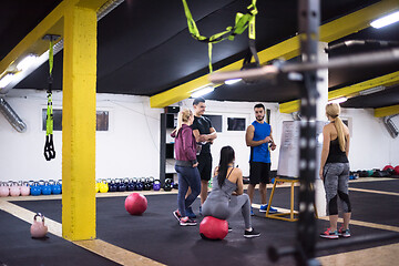 Image showing athletes getting instructions from trainer