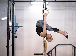 Image showing woman working out on gymnastic rings