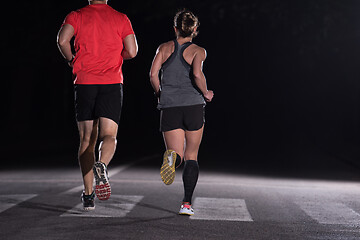 Image showing runners team on the night training