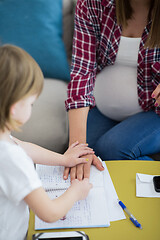 Image showing daughter painting nails to her pregnant mom