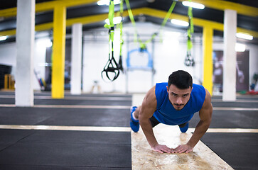 Image showing Young  man doing pushups