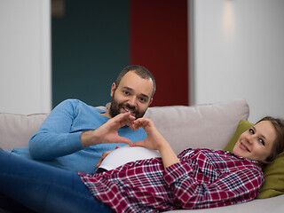 Image showing man and pregnant woman showing heart sign