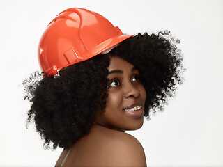 Image showing Portrait of confident female worker in orange helmet