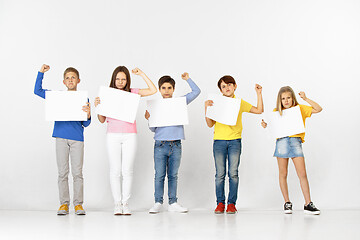 Image showing Group of children with a white banners isolated in white