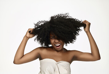 Image showing Portrait of a young black woman smiling with braces