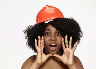 Image showing Portrait of confident female worker in orange helmet