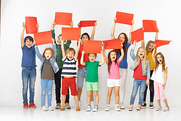 Image showing Group of children with a red banners isolated in white