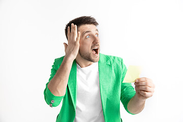 Image showing Young man with a surprised expression won a bet