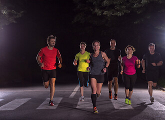 Image showing runners team on the night training