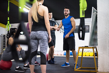 Image showing athletes getting instructions from trainer