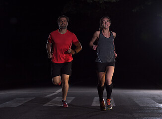 Image showing runners team on the night training