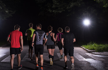 Image showing runners team on the night training