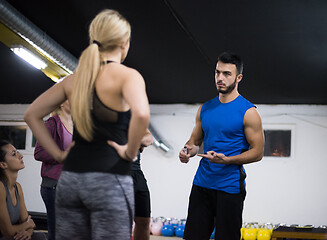 Image showing athletes getting instructions from trainer